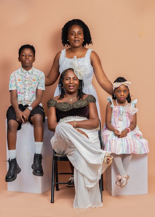 Free Photo Of Family Portrait With Elegant Attire On Neutral Background