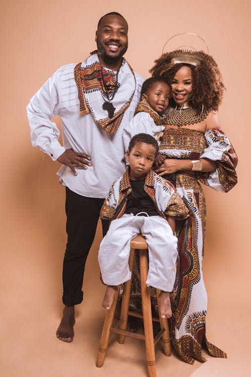 Free Photo Of Smiling Family In Traditional Clothing